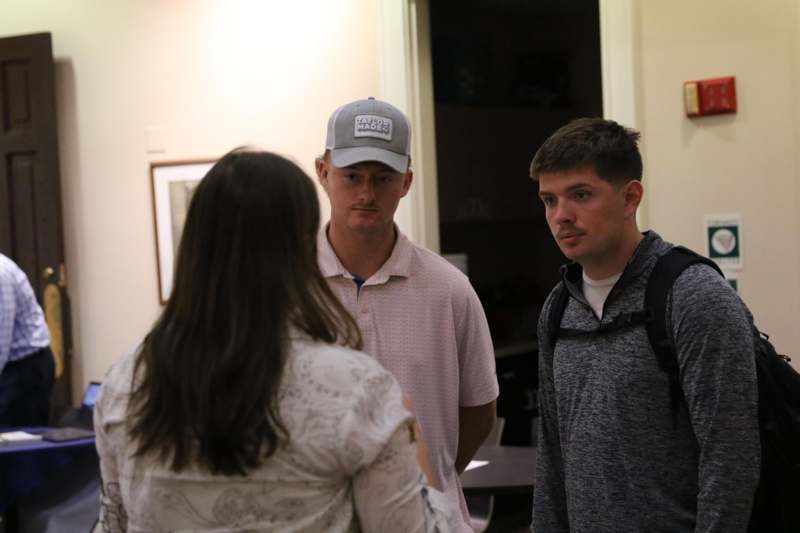 a group of people standing in a room