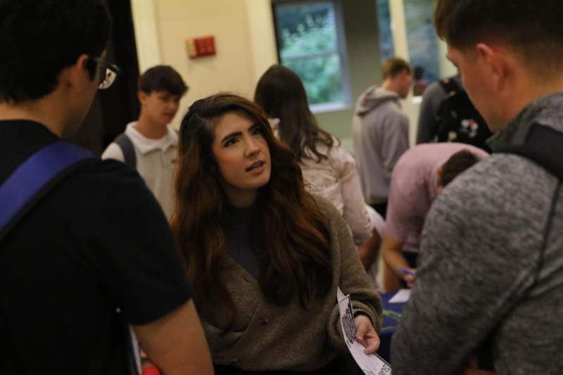 a woman holding a piece of paper