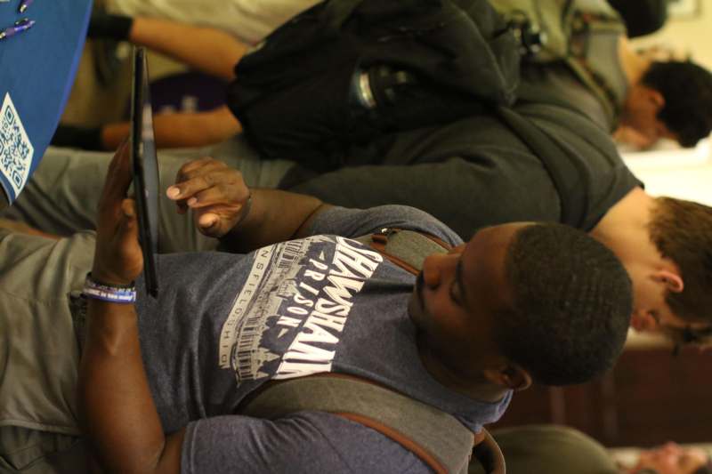 a man looking at a tablet