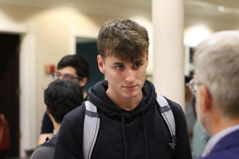 a man in a black sweatshirt