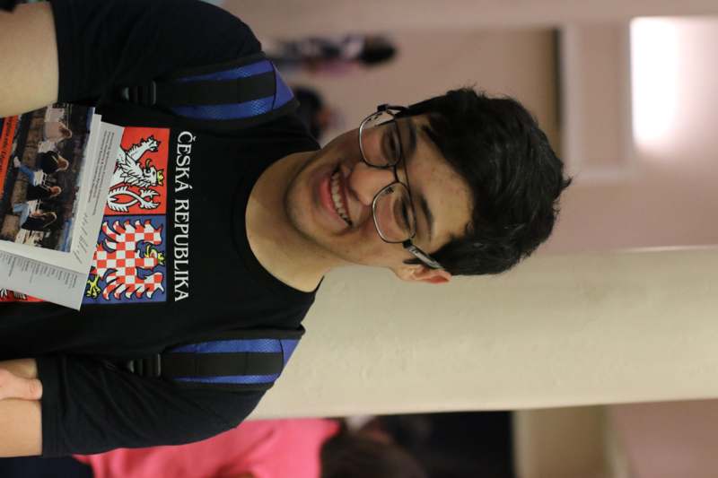 a man wearing glasses and a backpack