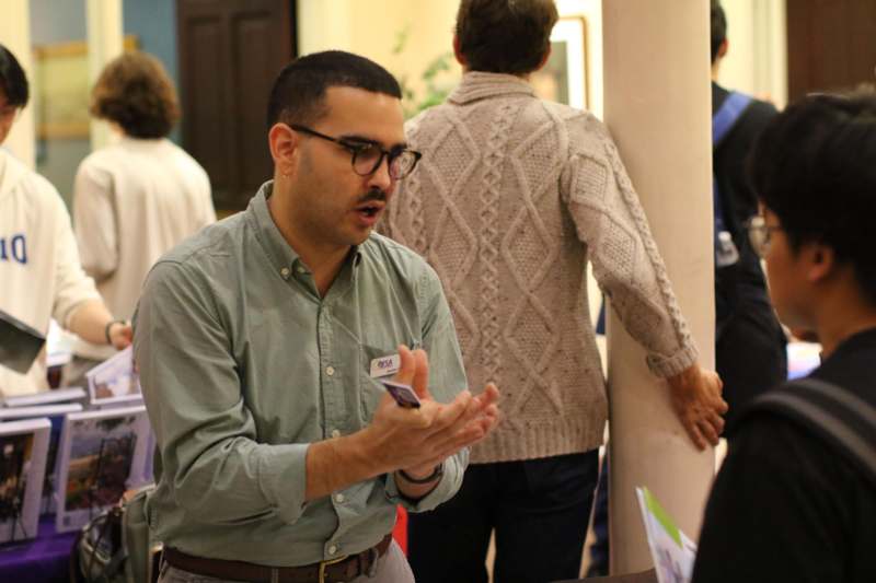a man talking to a group of people