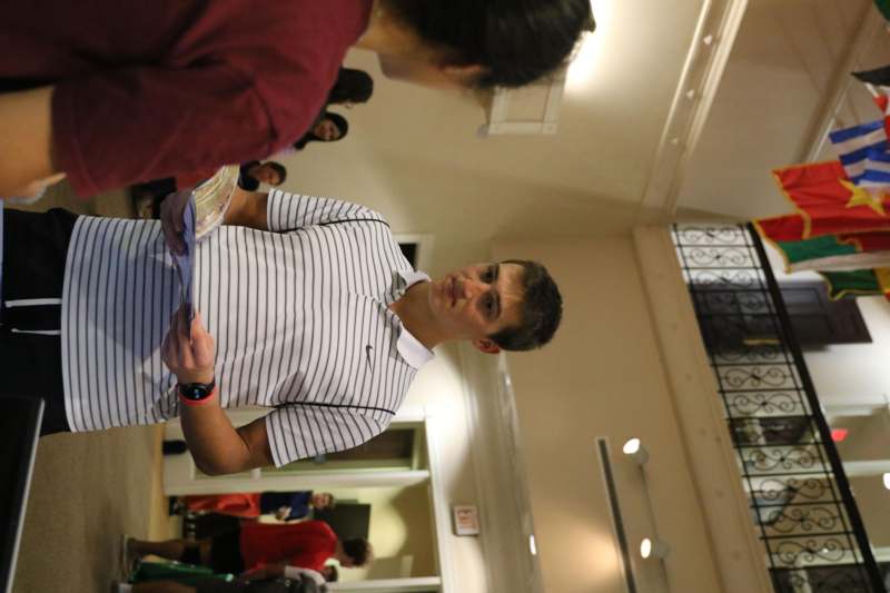 a man holding a piece of paper