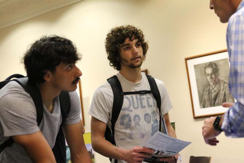 a group of men looking at something