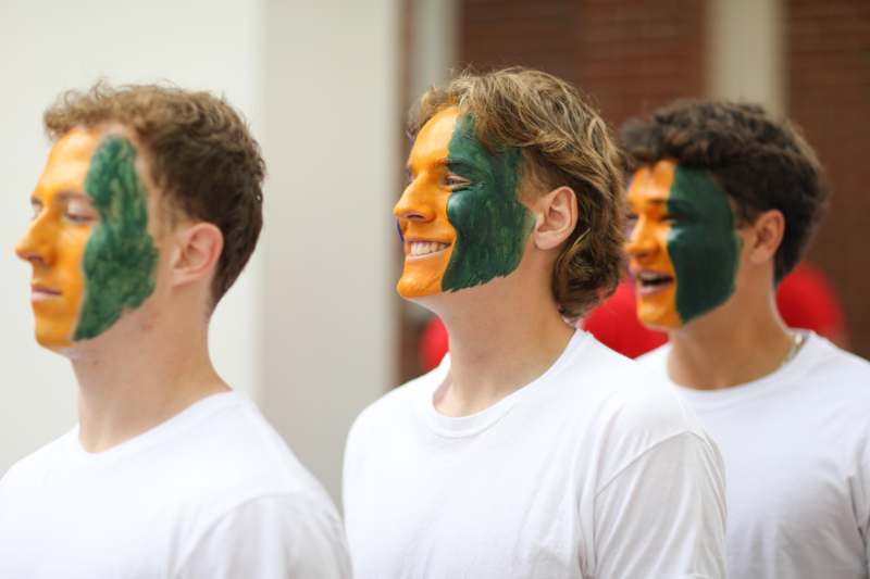a group of men with face paint