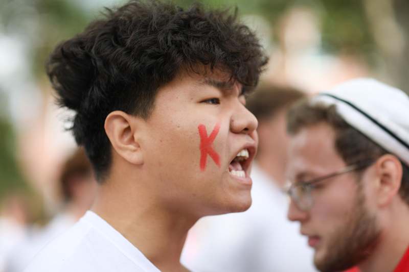 a man with a red x on his face