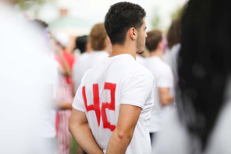 a man in a white shirt with a number on his back