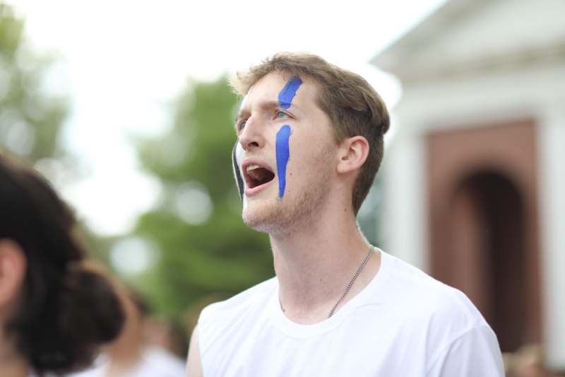 a man with blue paint on his face
