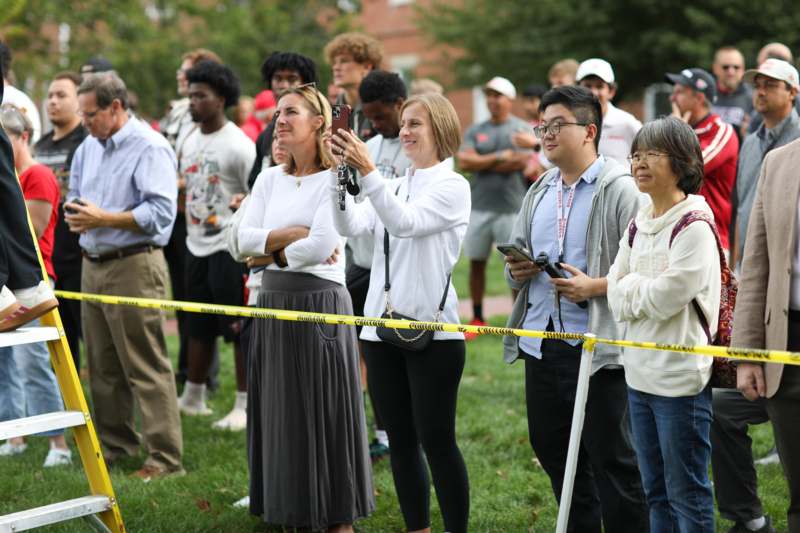 a group of people standing in a line