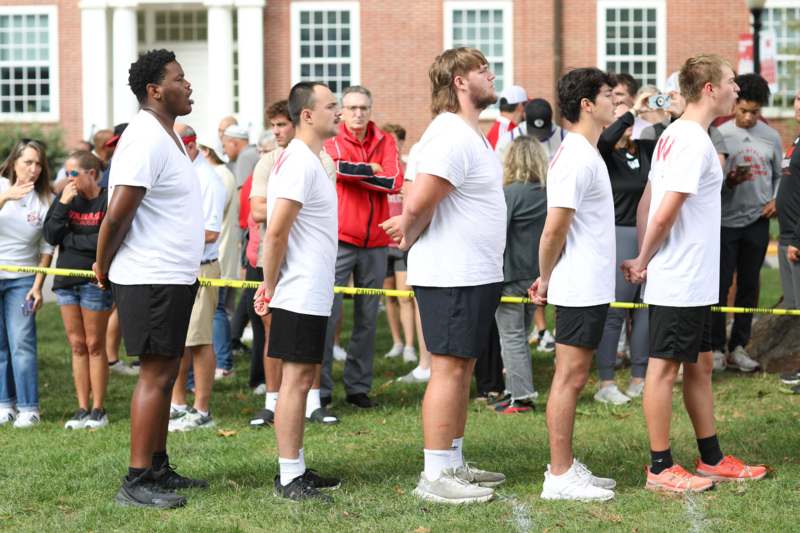 a group of men standing in a line