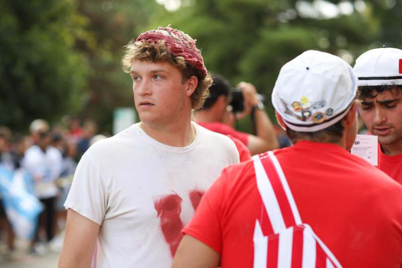 a man wearing a red hat and white shirt