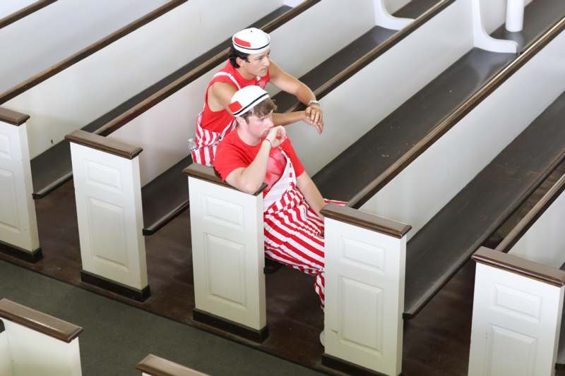 two men sitting on the stairs