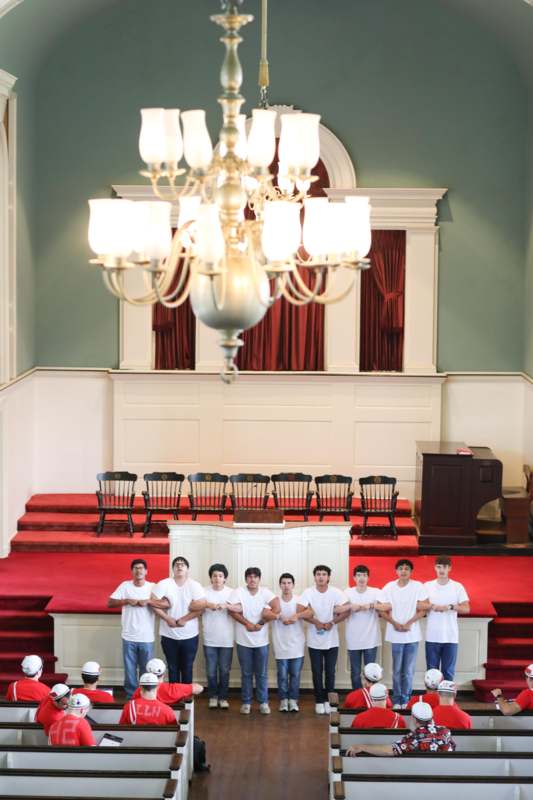 a group of people standing in front of a stage