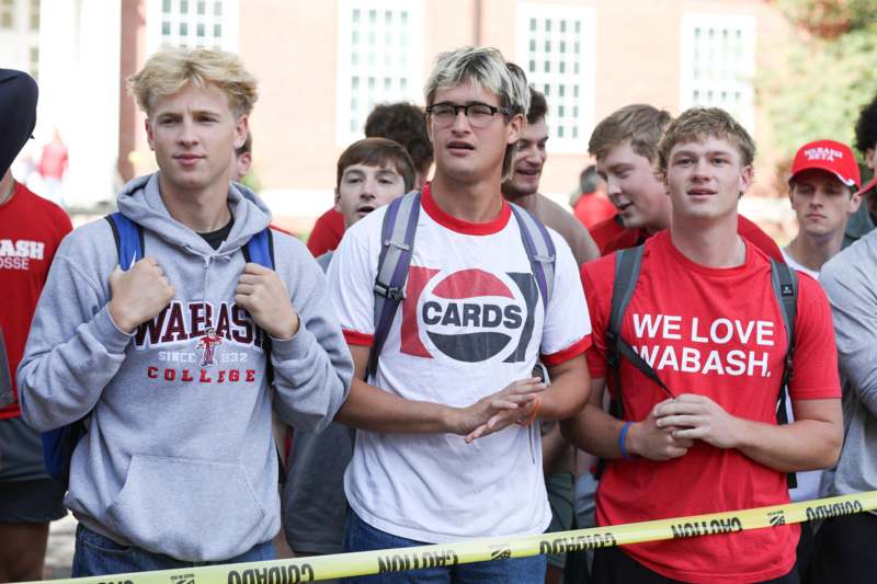 a group of young men standing in a line