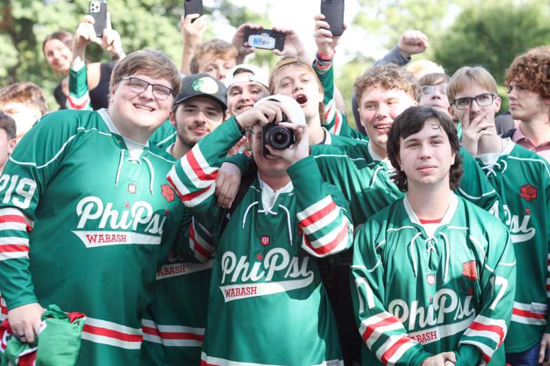 a group of people in green uniforms