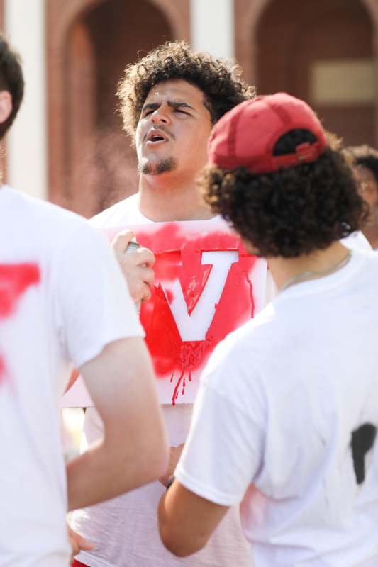 a group of people wearing white shirts