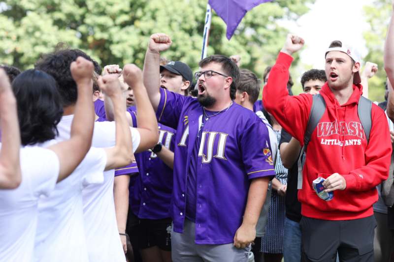 a group of people with their fists raised