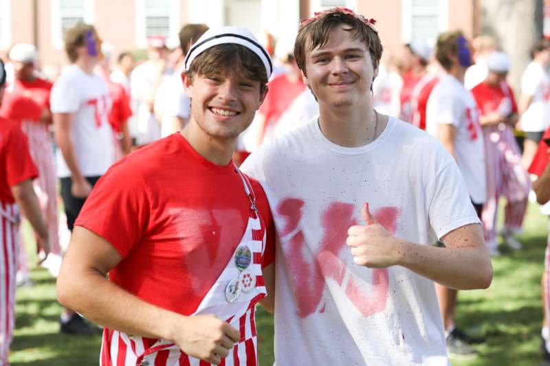 two men standing together smiling
