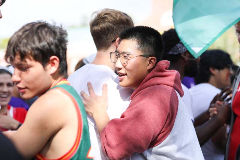 a man hugging another man