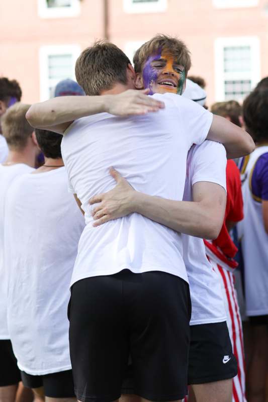 a man hugging another man