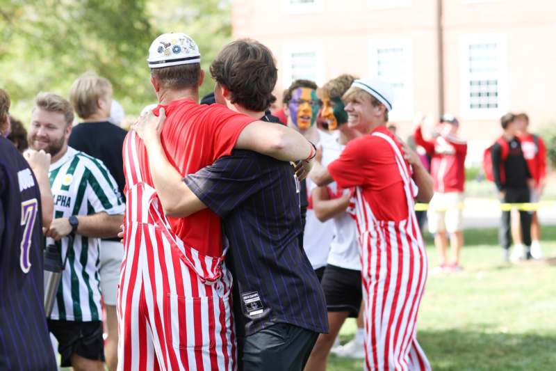 a group of men hugging