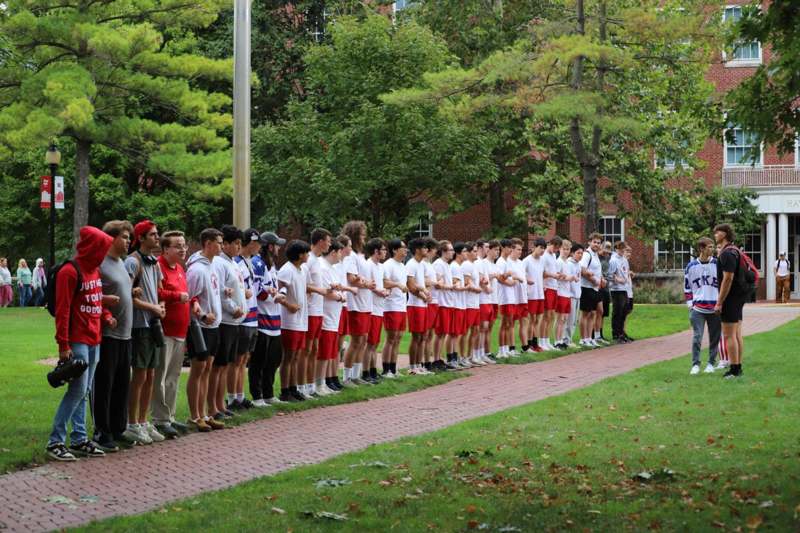 a group of people standing in a line
