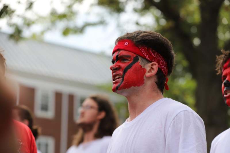 a man with red face paint