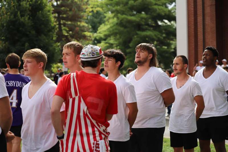 a group of men standing outside