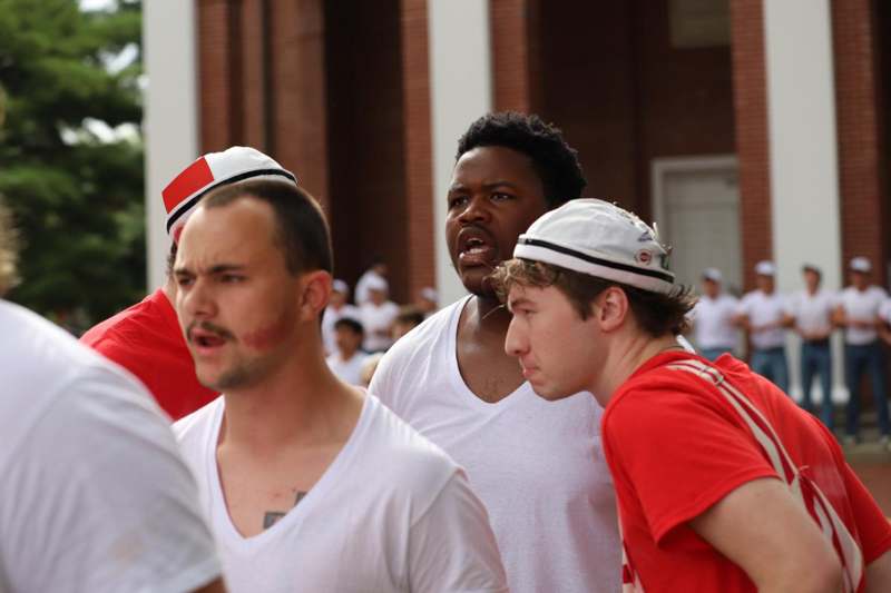 a group of men wearing hats