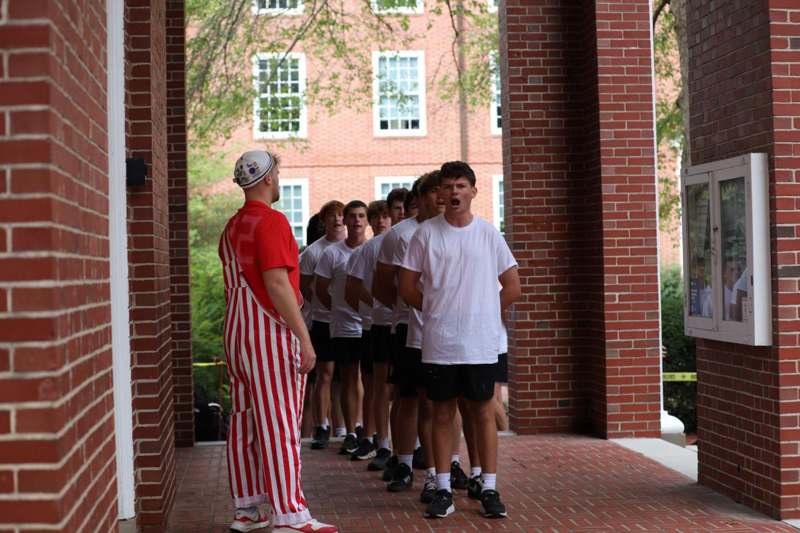 a group of people standing in a line