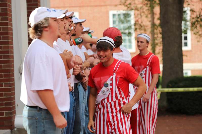 a group of men wearing matching outfits