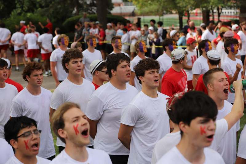a group of people in white shirts