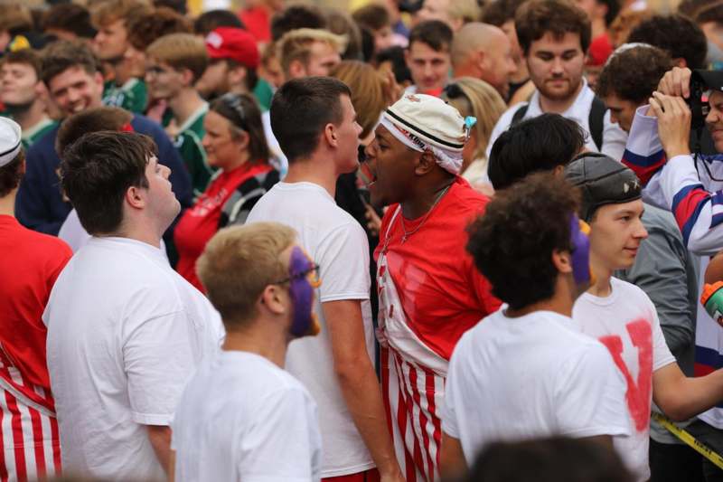 a group of people standing in a crowd