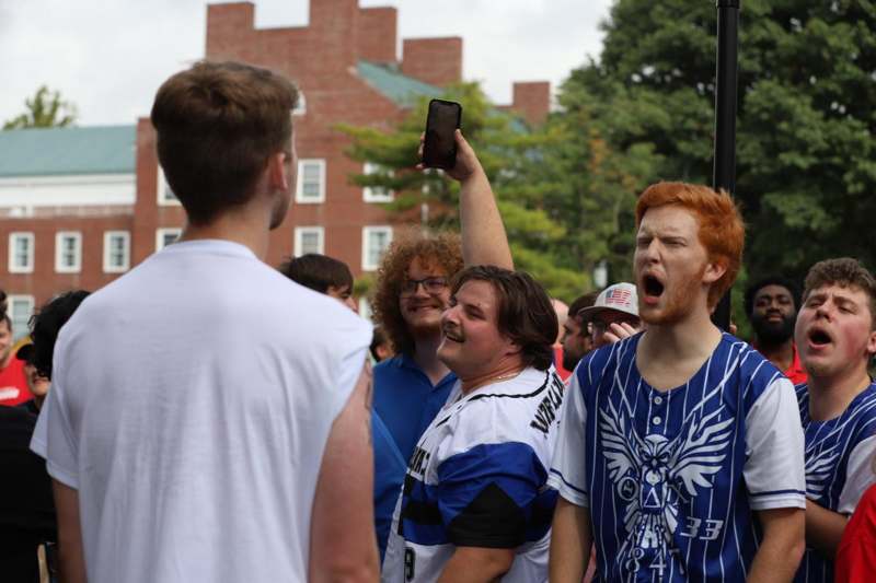 a group of men standing outside
