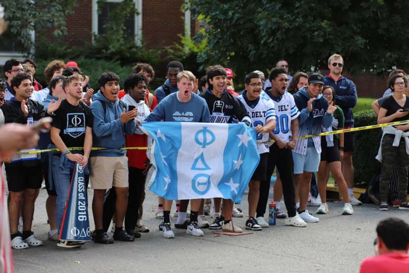 a group of people holding a flag