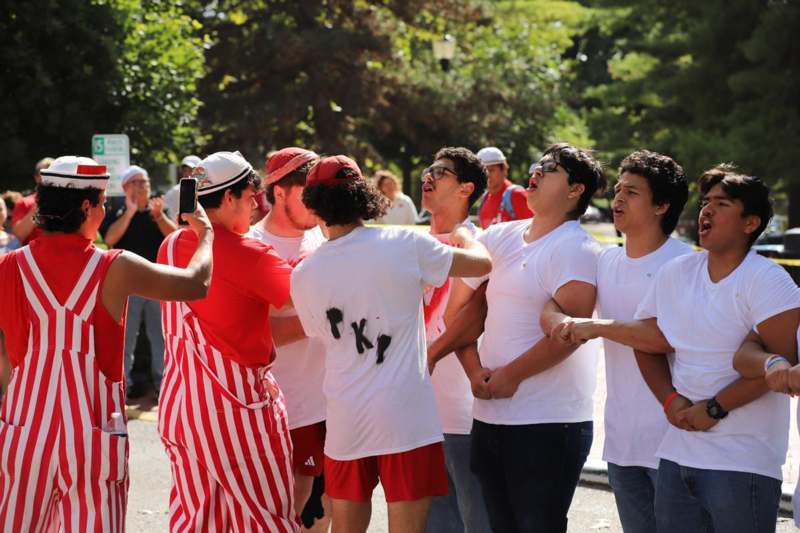 a group of people standing on a street