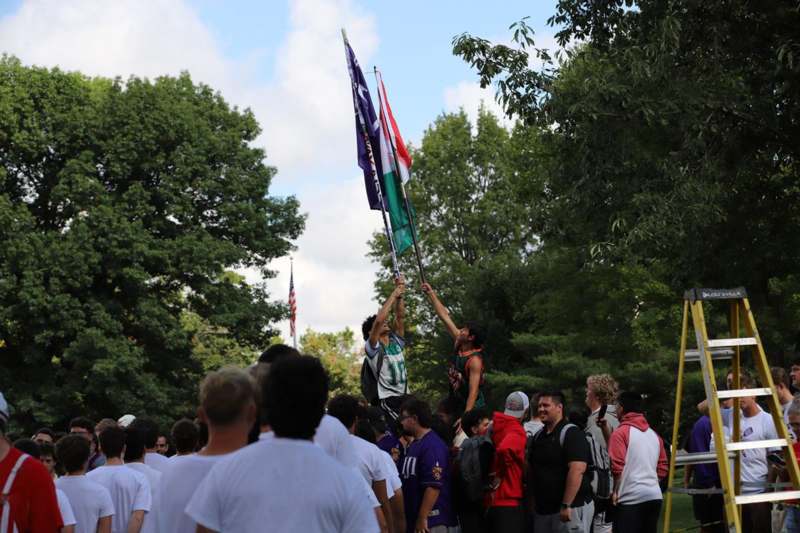 a group of people holding flags