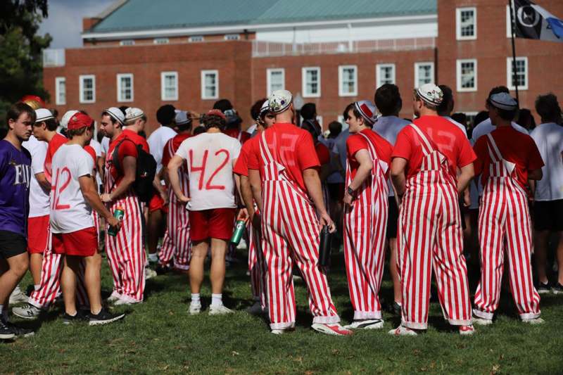 a group of people in striped uniforms