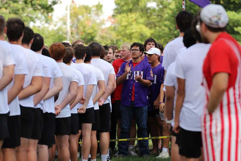 a group of people standing in a line