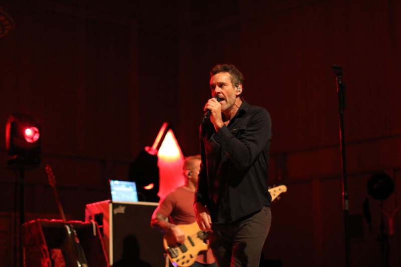 a man singing into a microphone