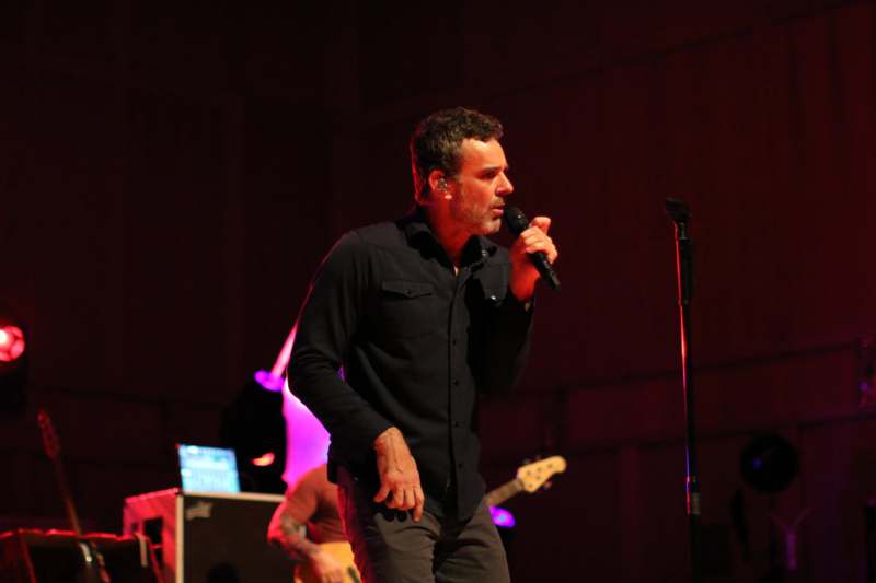 a man singing into a microphone