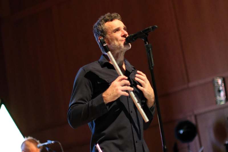 a man singing into a microphone