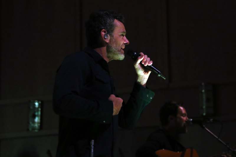 a man singing into a microphone