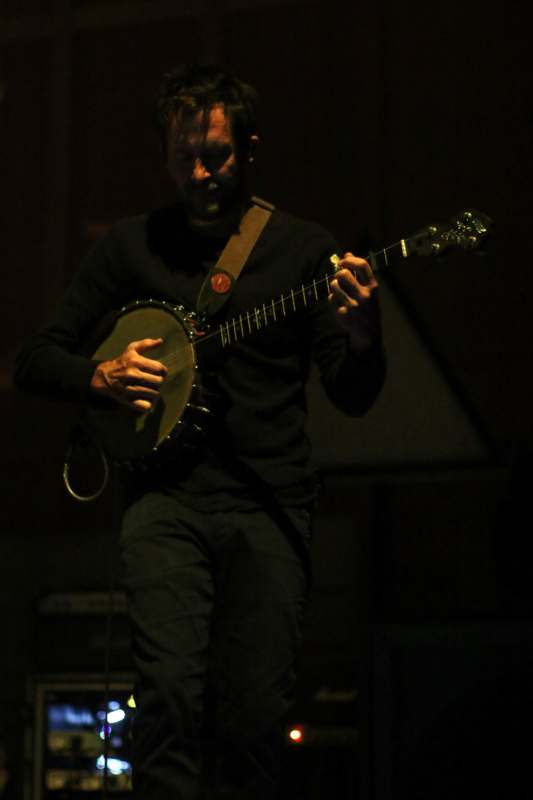 a man playing a banjo