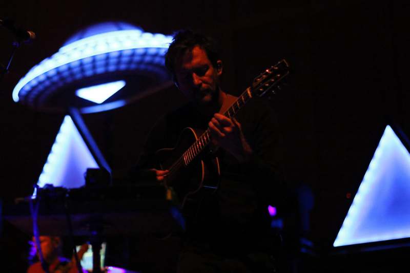 a man playing a guitar
