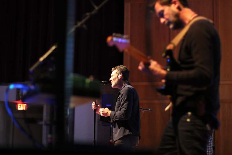a man singing into a microphone