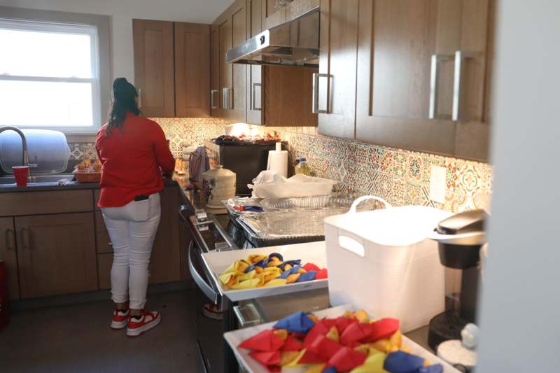 a woman standing in a kitchen