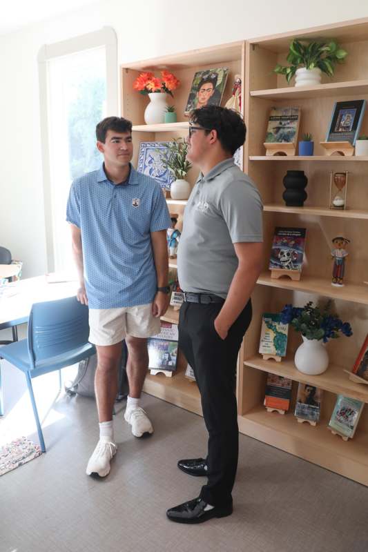 two men standing in a room