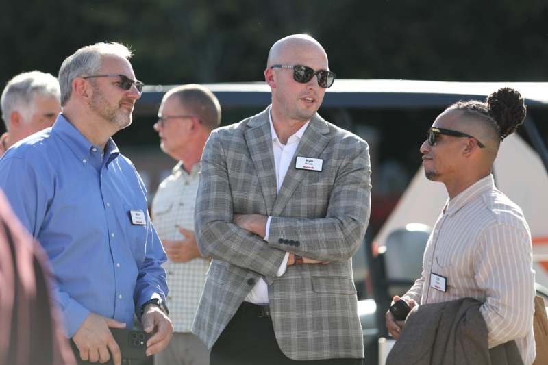 a group of men standing outside