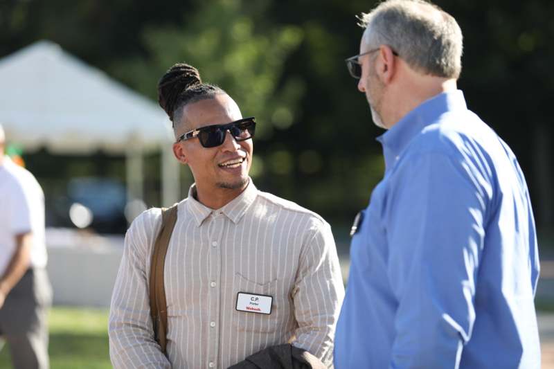 a man talking to another man